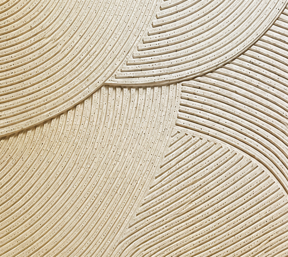 Halo Haze, a sculptural irregular artwork with flowing cream and ochre lines